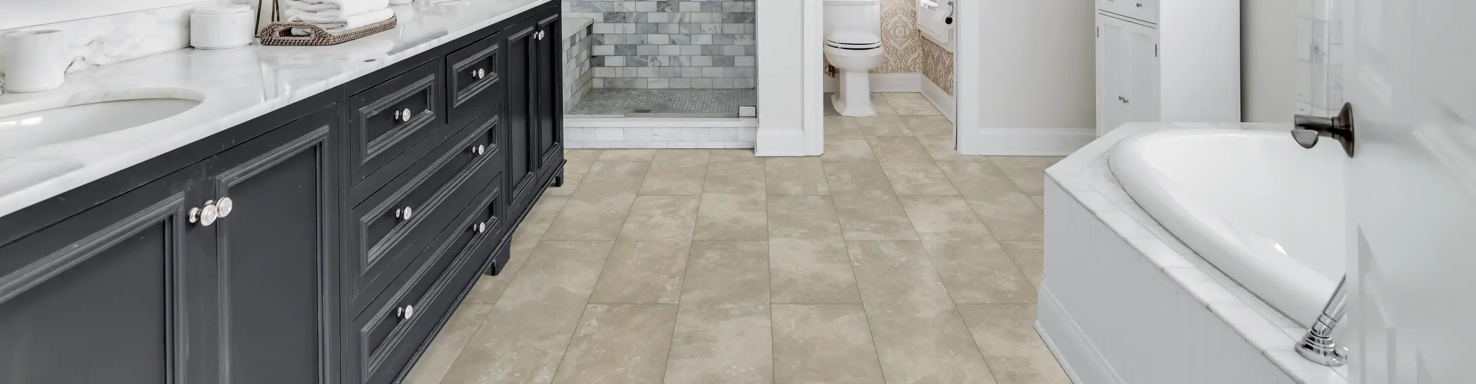 Tile shower with neutral colors. 